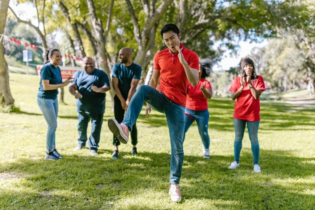 Adults in park being active